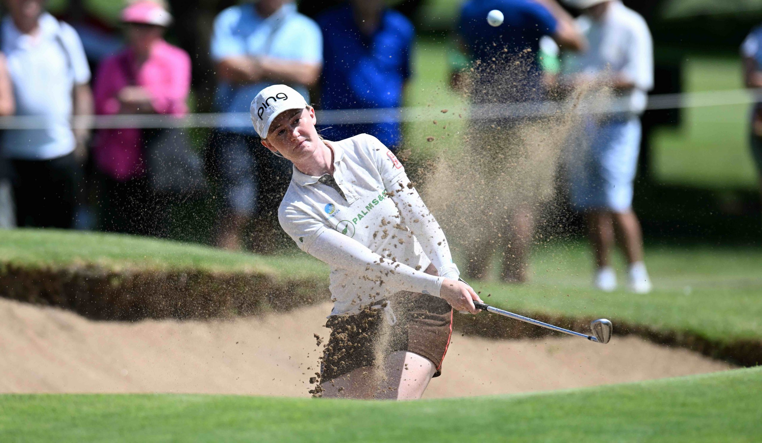 Karis Davidson hitting out of a bunker.